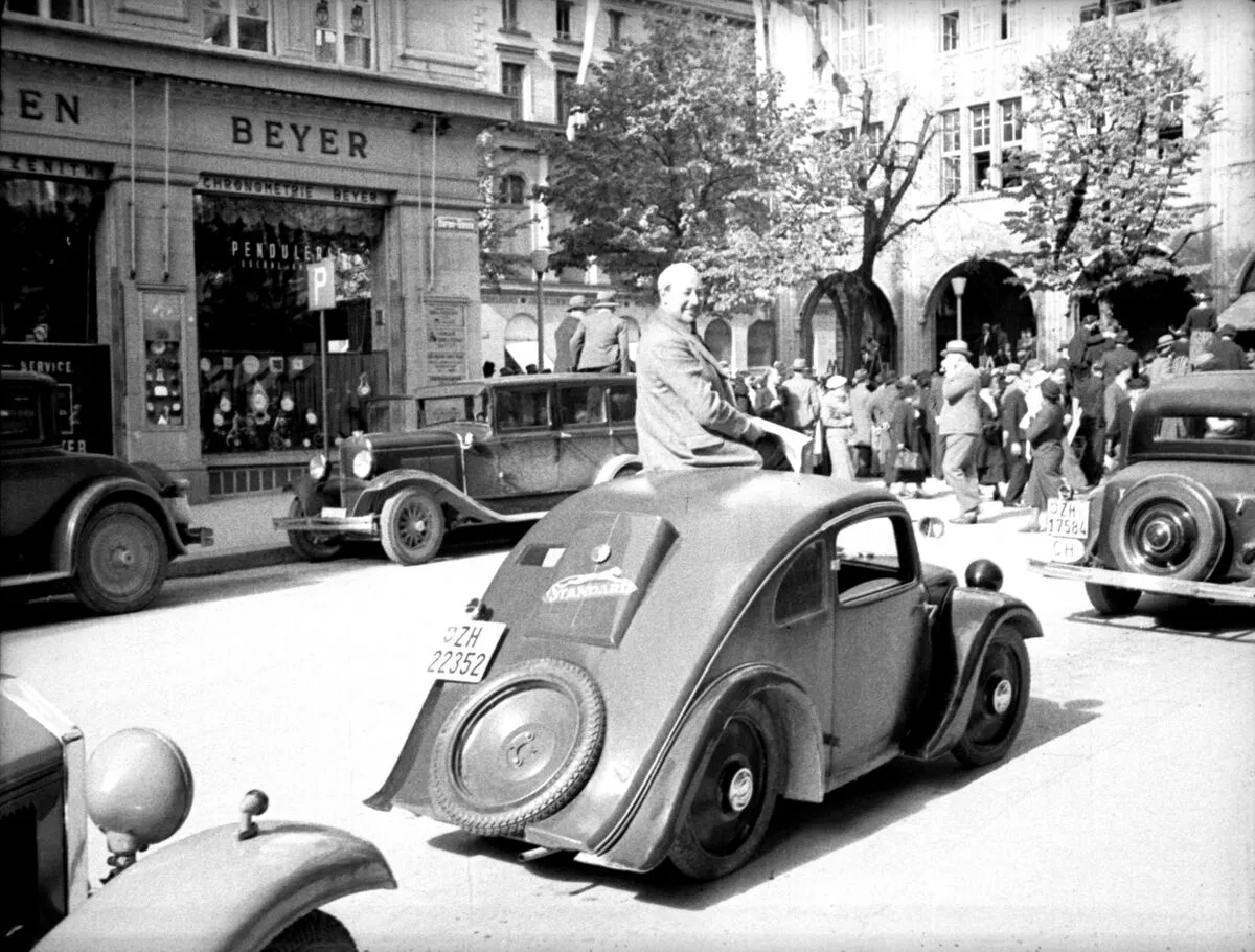 Josef Ganz sitting on the rooftop of a Standard Superior Type 2 in Zurich, 1935